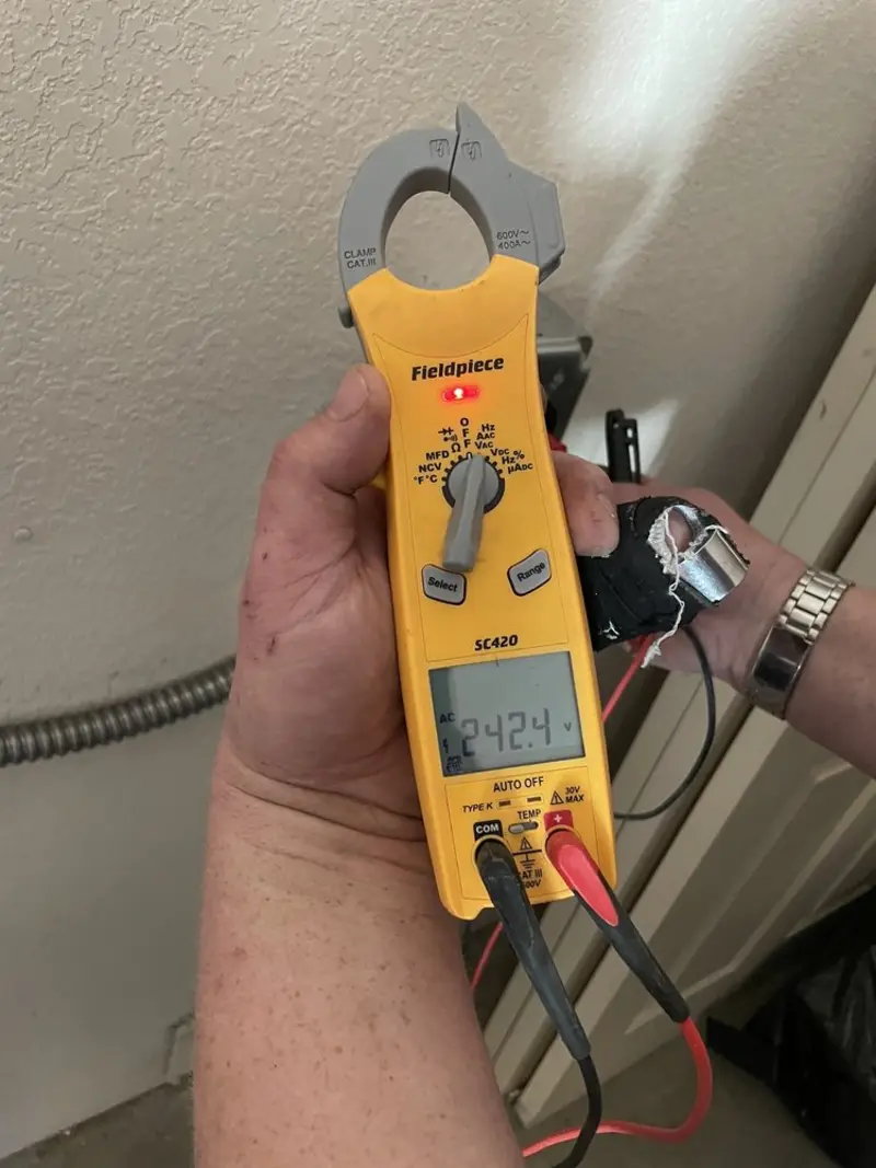 Voltage testing with clamp meter during Ceiling Fan Installation in New Fairfield